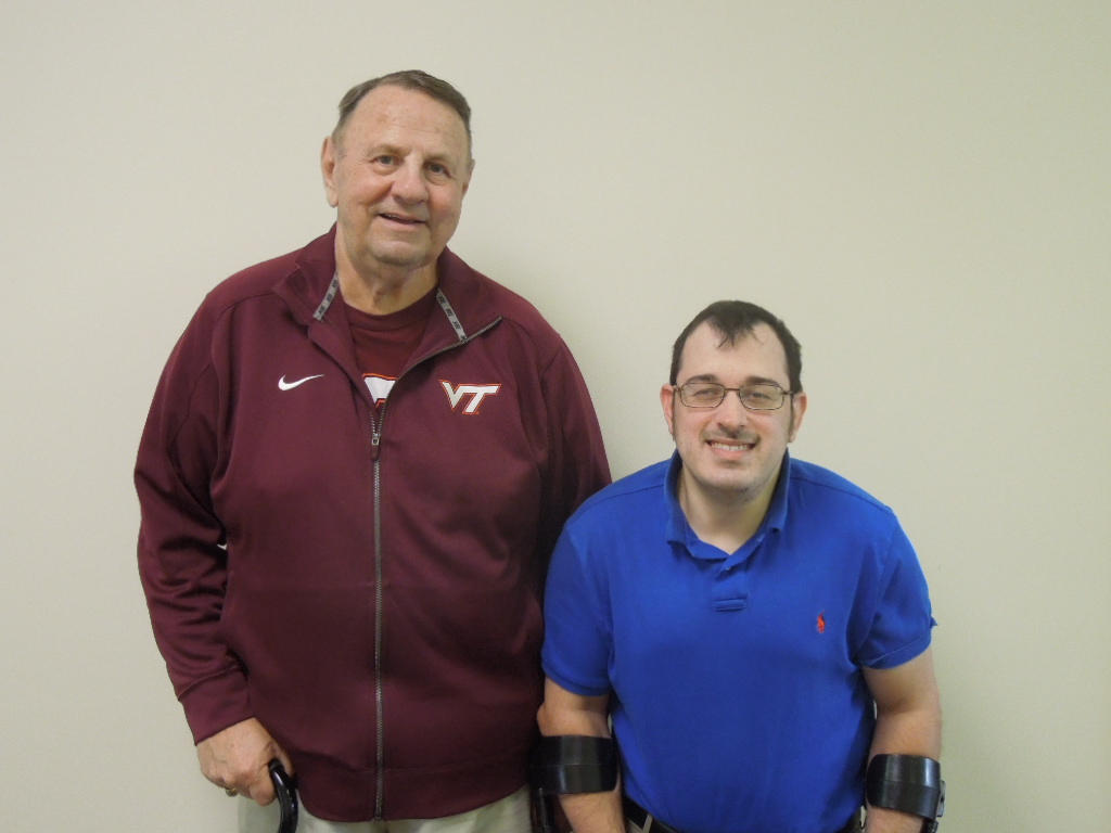 A happy consumer stands beside the Center's Independent Living Coordinator, Matt Shelor